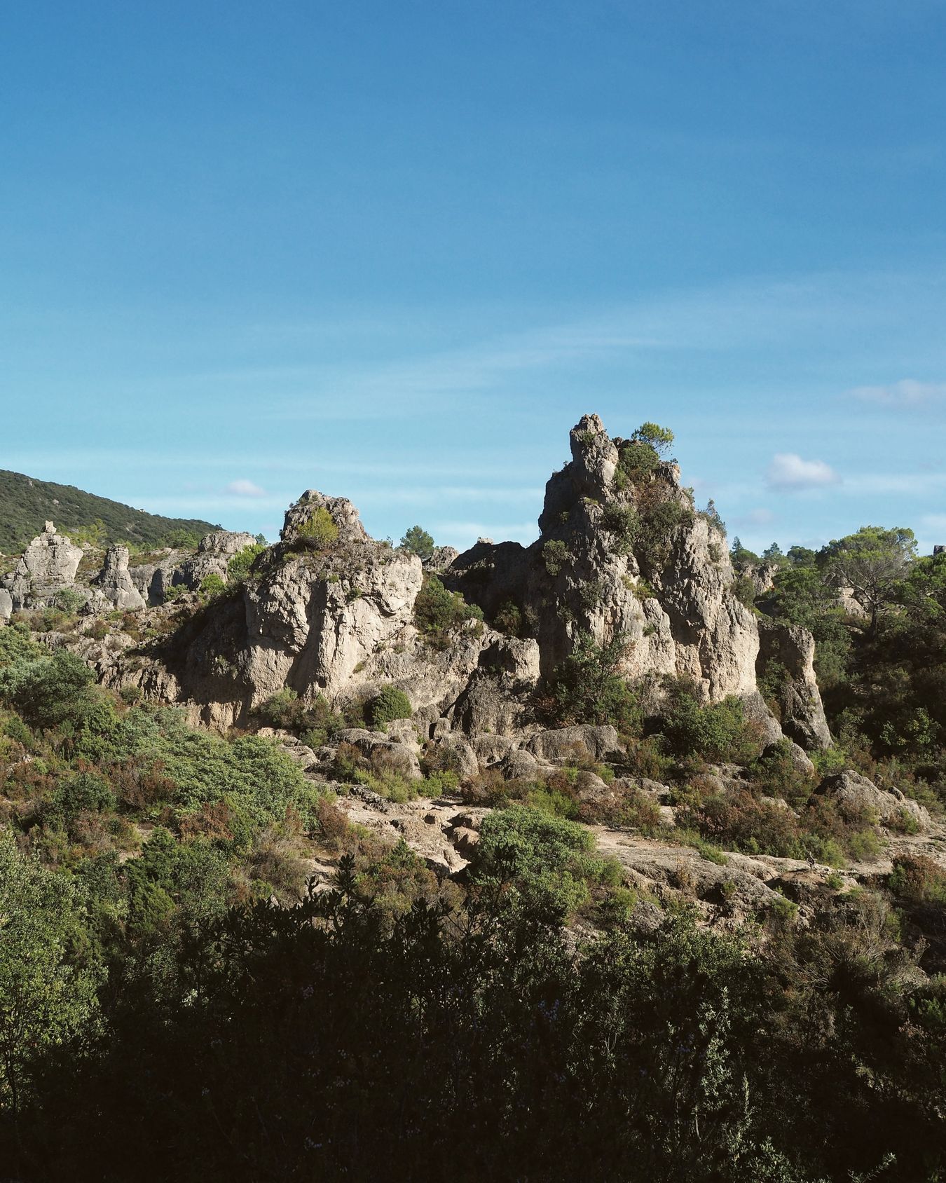 The dolomite columns of the cirque de Mourèze rising above the garrigue