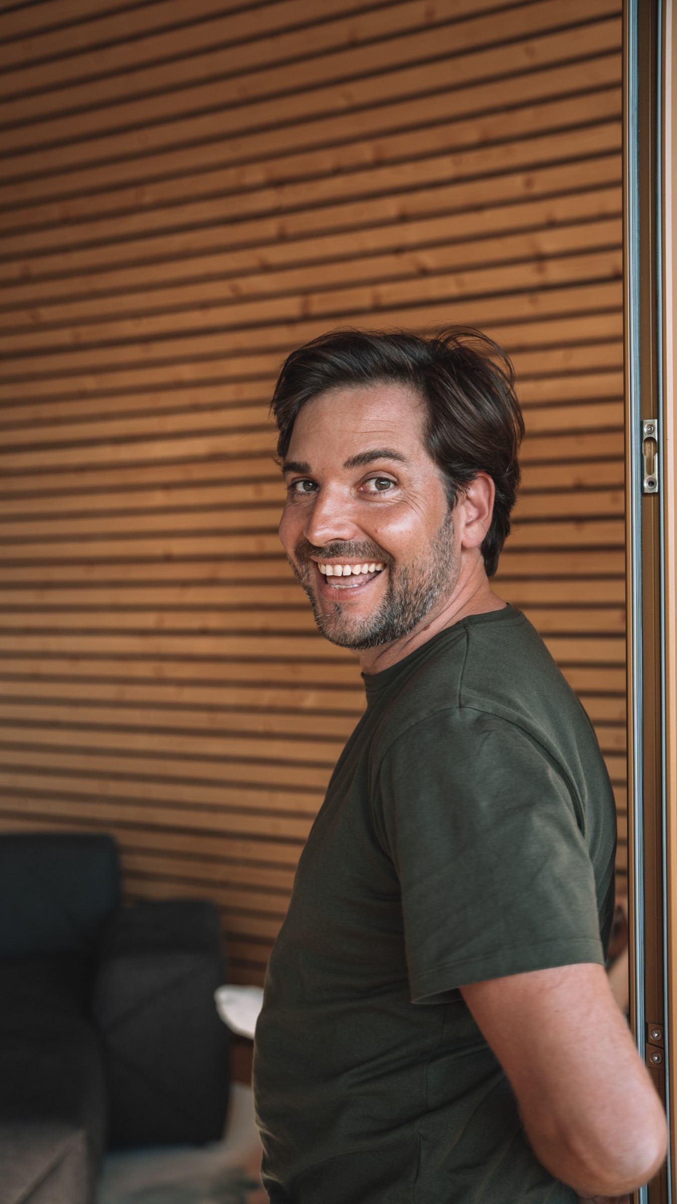 Fabien smiling in the entrance of a Souki lodge